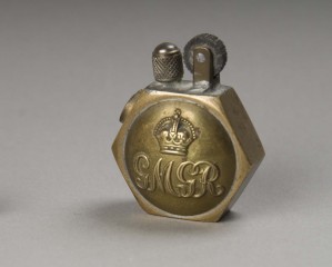 A 'lucifer' - cigarette lighter customised with a Machine Gunner's tunic button